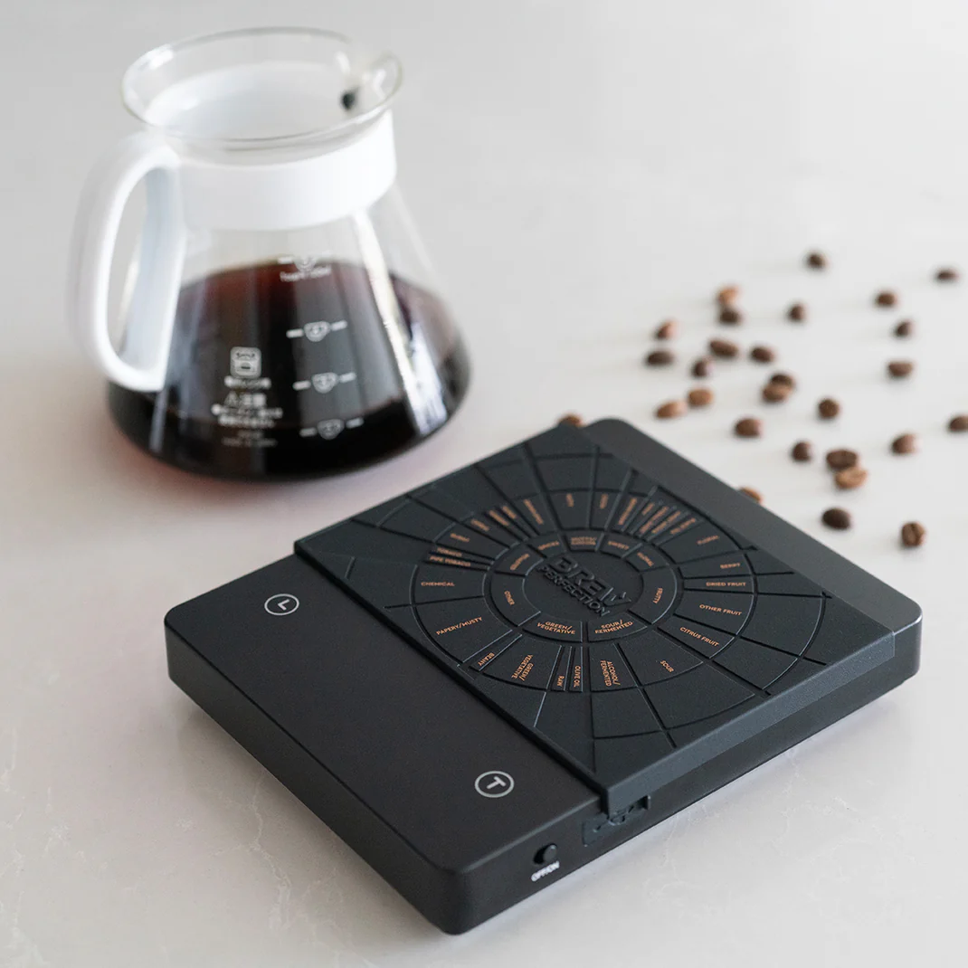 pour over coffee on a coffee scale with coffee grinder